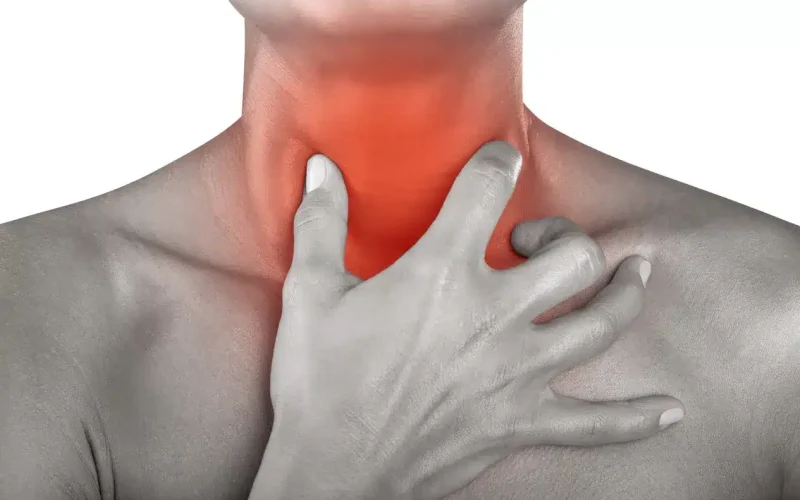 A person holding their throat, which is highlighted in red to indicate pain or discomfort.