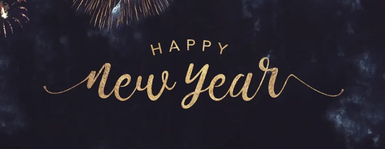 Gold text reading "Happy New Year" is centered against a dark sky background with multiple fireworks bursting around the edges.